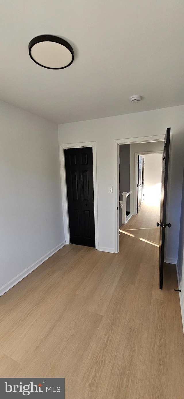 unfurnished bedroom featuring light hardwood / wood-style floors