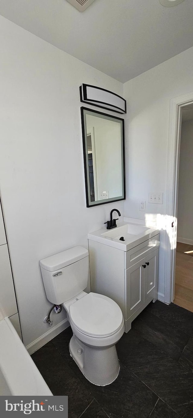 bathroom with vanity and toilet