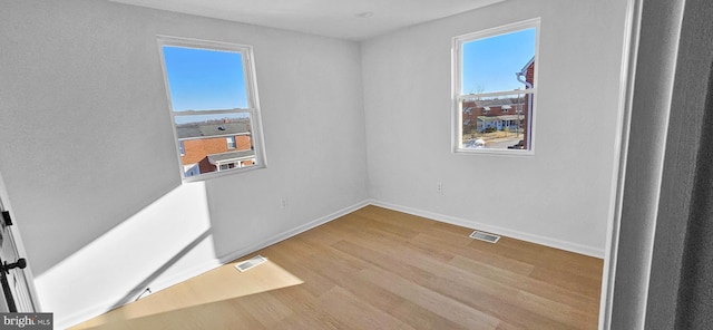 empty room featuring light hardwood / wood-style floors