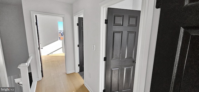 corridor featuring light hardwood / wood-style flooring