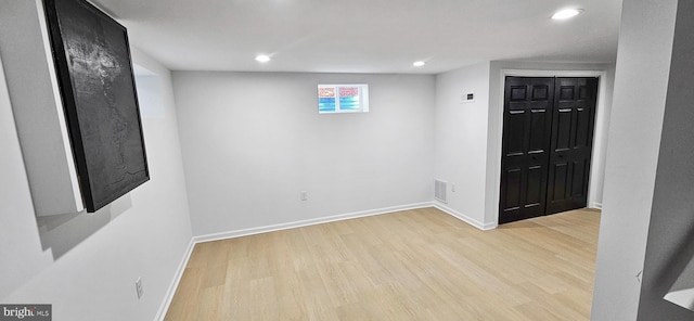 basement featuring light wood-type flooring