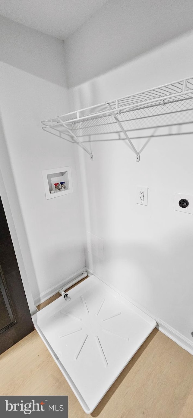 laundry room with hookup for a washing machine and hardwood / wood-style floors