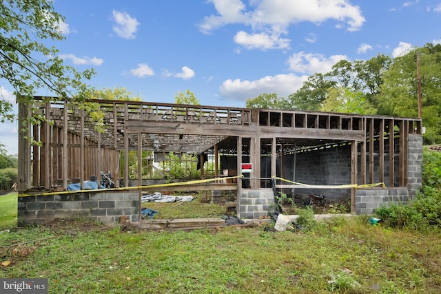 exterior space with a yard and an outbuilding