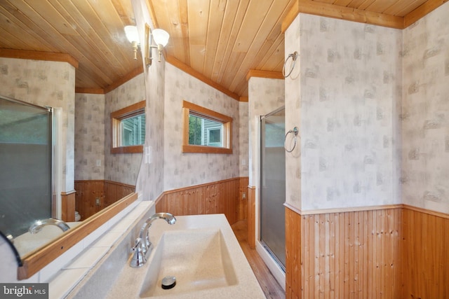 bathroom with sink, wood ceiling, wooden walls, and ornamental molding