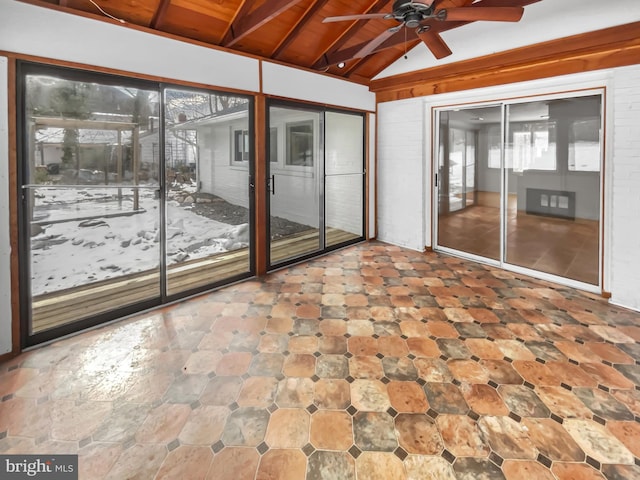 unfurnished sunroom with ceiling fan, lofted ceiling, and wood ceiling