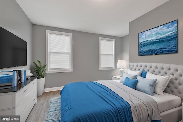 bedroom with light hardwood / wood-style floors