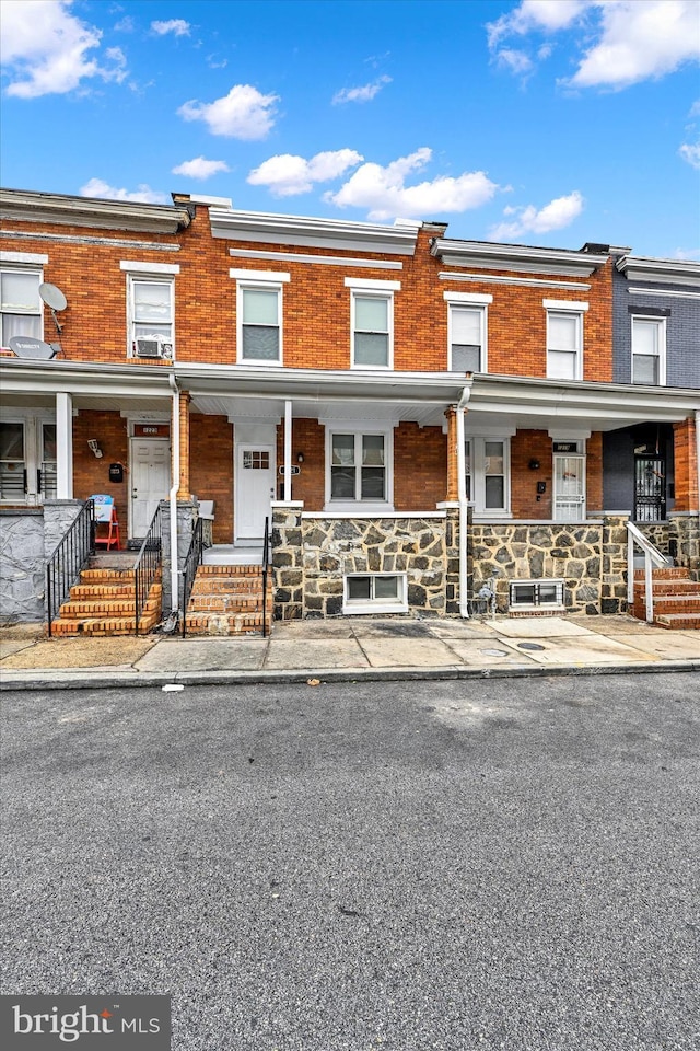 townhome / multi-family property with covered porch