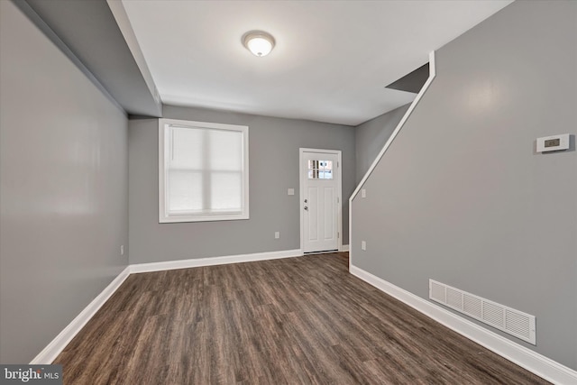 foyer entrance featuring dark hardwood / wood-style flooring