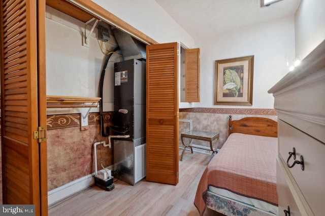 bedroom with light wood-type flooring