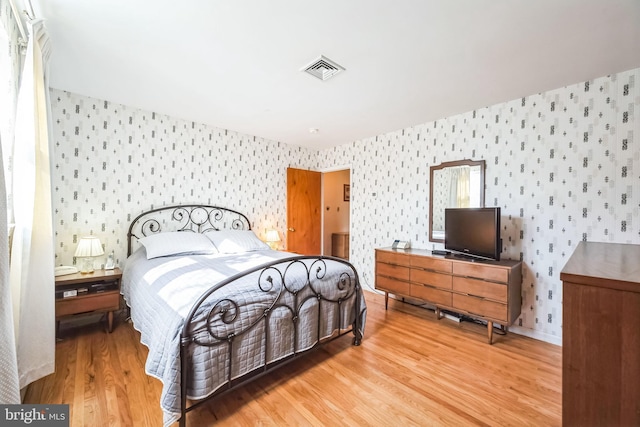 bedroom featuring light hardwood / wood-style floors