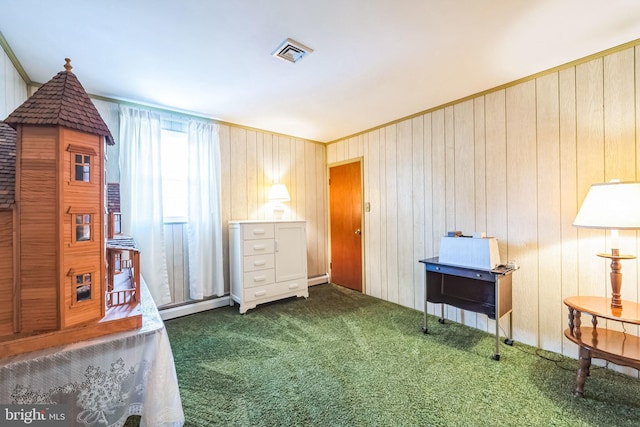 miscellaneous room featuring ornamental molding and dark colored carpet