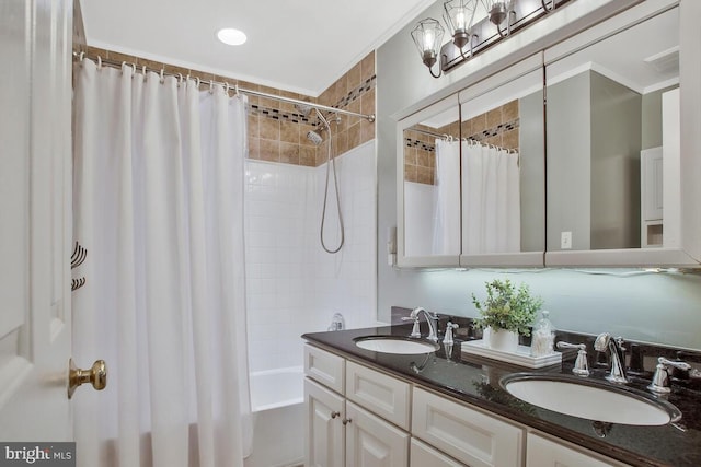 bathroom featuring shower / tub combo with curtain, vanity, and crown molding