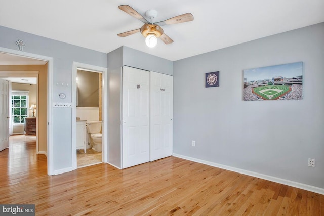 unfurnished bedroom featuring light hardwood / wood-style floors, a closet, and ceiling fan