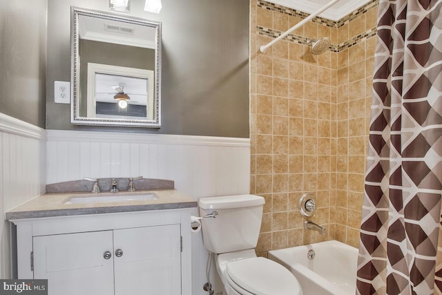 full bathroom featuring vanity, shower / bath combo, and toilet