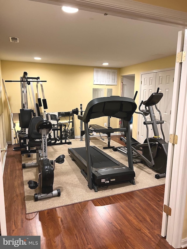 exercise room featuring hardwood / wood-style floors