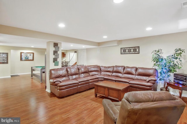 living room featuring billiards and light hardwood / wood-style floors