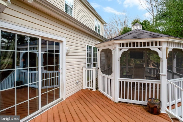 wooden terrace with a sunroom