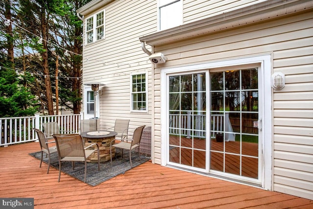 deck with an outdoor fire pit