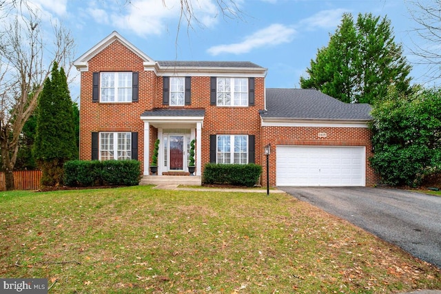 view of front facade featuring a garage and a front lawn