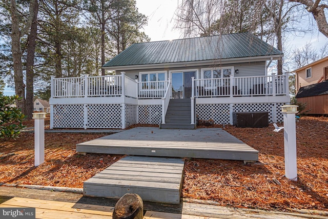 back of property featuring a deck