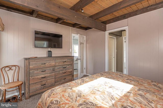 carpeted bedroom with wood ceiling and beam ceiling