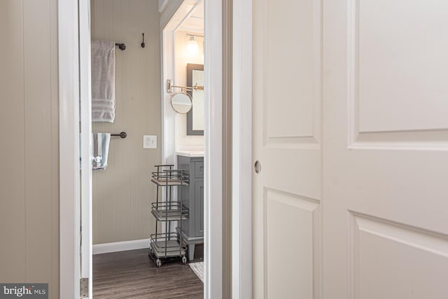 bathroom with hardwood / wood-style floors