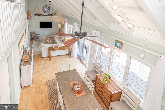 living room with vaulted ceiling with beams and ceiling fan