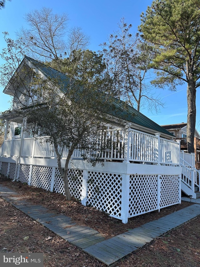 view of side of property featuring a deck