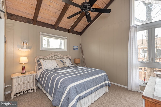 bedroom with wood walls, vaulted ceiling with beams, light colored carpet, ceiling fan, and wood ceiling