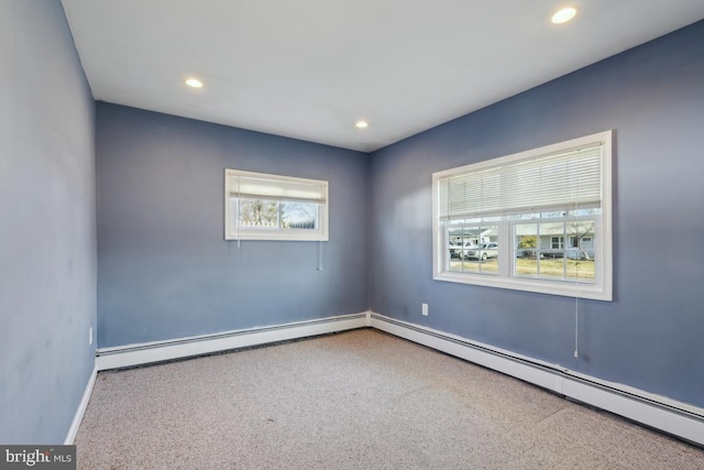 carpeted empty room with recessed lighting, baseboards, and baseboard heating