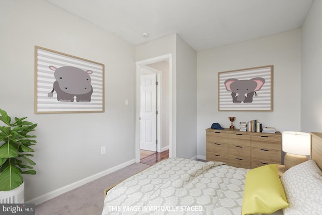 carpeted bedroom featuring baseboards