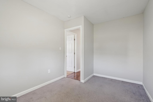 unfurnished bedroom with baseboards and carpet floors