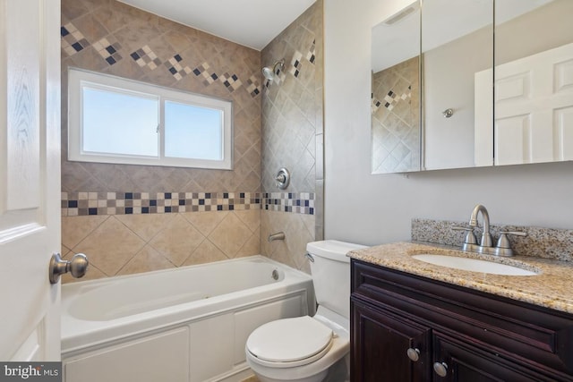 bathroom with shower / washtub combination, toilet, and vanity