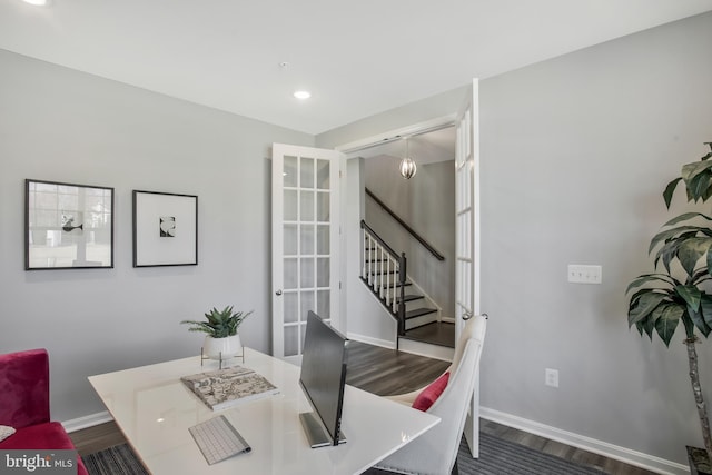 dining space featuring hardwood / wood-style floors and french doors