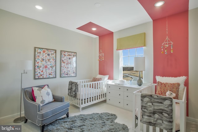 bedroom with a nursery area