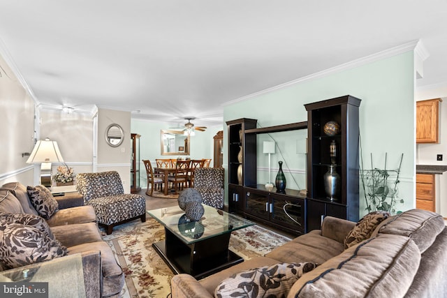 living room featuring crown molding and ceiling fan