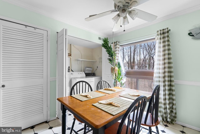 dining room with ornamental molding, washer and clothes dryer, and ceiling fan