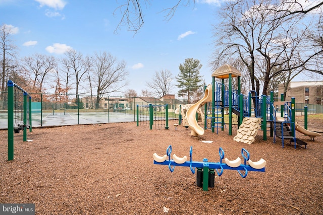 view of playground with tennis court