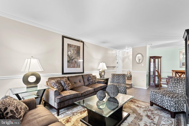 living room with hardwood / wood-style floors and crown molding