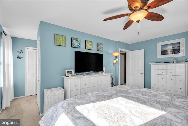 bedroom with light colored carpet and ceiling fan