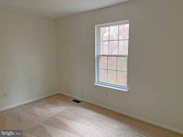 unfurnished room featuring carpet floors