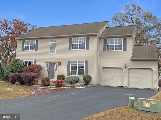 colonial home with a garage