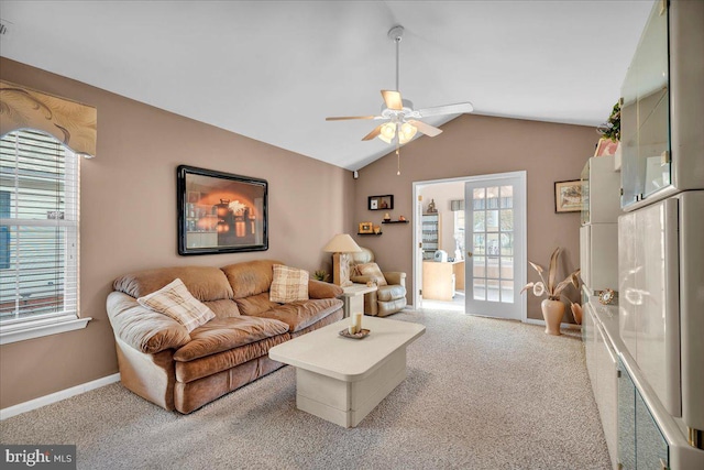 living room with lofted ceiling, carpet, ceiling fan, and french doors