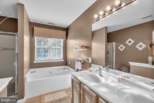 bathroom with vanity, tile patterned flooring, and shower with separate bathtub