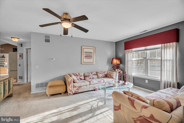 living room featuring ceiling fan and light carpet