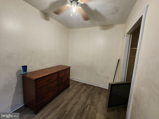 bedroom featuring ceiling fan and dark hardwood / wood-style floors