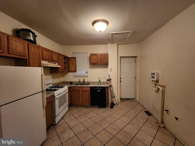 kitchen with sink, white appliances, and light tile patterned floors