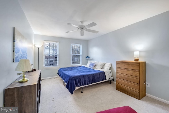 bedroom featuring ceiling fan and light carpet