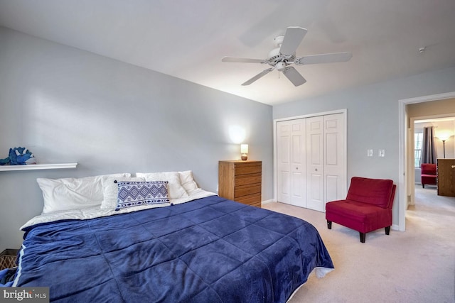 bedroom with carpet floors, ceiling fan, and a closet