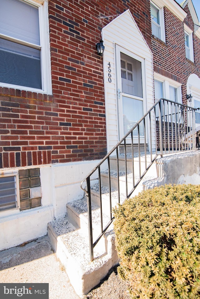 entrance to property with brick siding